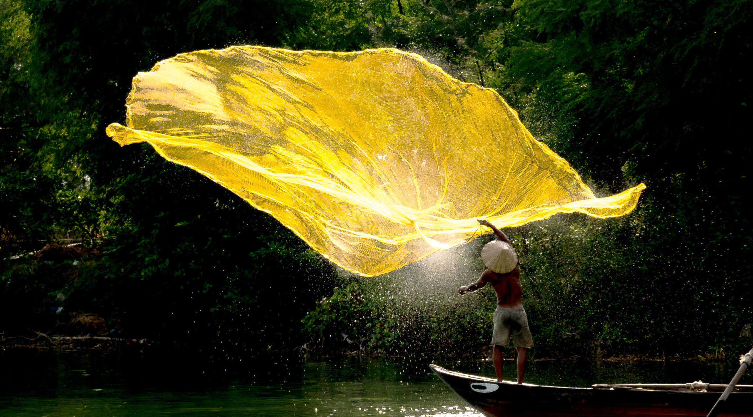 Fishing net in the sunrise on Hoai river VietNam